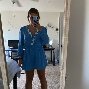 blue romper with flower detailing